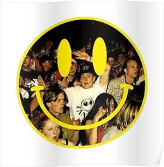 a group of people standing together in front of a smiley face with two hands up