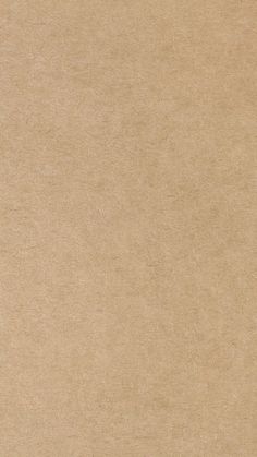 an orange and white cat laying on top of a piece of cardboard