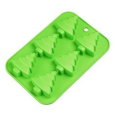 green christmas tree shaped ice cube tray with holes in the shape of trees on it