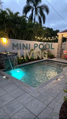 Luxurious mini pool at dusk with LED lights, modern grey decking, tropical plants, and a waterfall, featuring "Mini Pool Living" overlay.