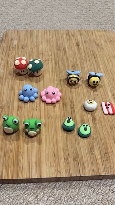 there are many small toy animals on the table