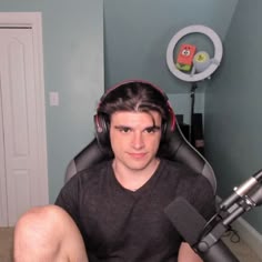 a man with headphones on sitting in a chair