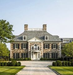 a large stone house with lots of windows