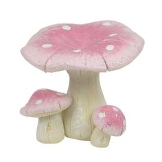 a pink mushroom with white dots on it
