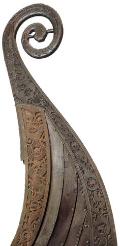 an intricately carved metal object is shown against a white background with no one in it