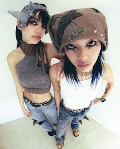 two young women are standing next to each other