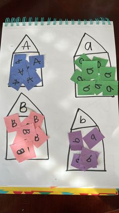 a piece of paper that has been cut out to look like houses and numbers on it