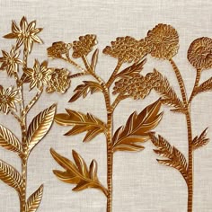 golden flowers and leaves on a white background