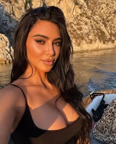 a beautiful woman in a black top on a boat