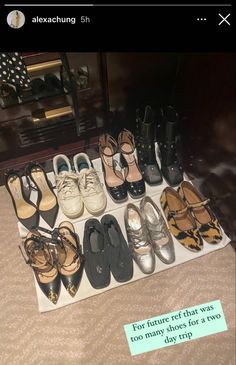 there are many pairs of shoes on display