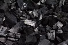 black and white photograph of wood chips or coals for making firecrackers