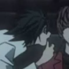 two people with dreadlocks standing next to each other