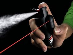 a person is spraying something with a sprayer on their finger and the other hand holding it