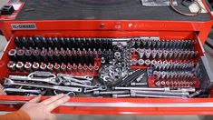 a red tool box filled with lots of tools