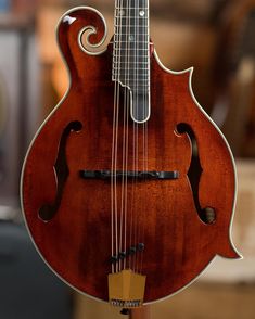 an old guitar is on display in a shop