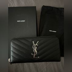 Ysl Zip Wallet In Black With Silver. New Never Used. Ysl Wallet Purse, Ysl Wallets, Ysl Long Zodiac Wallet, Ysl Zodiac Wallet, Ysl Wallet With Box, Yves Saint Laurent Wallet Collection, Ysl Wallet Black, Luxury Black Ysl Wallet, Ysl Wallet With Authenticity Card