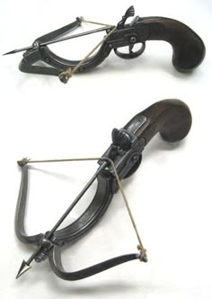 two old fashioned bow and arrow bows on white background with clippings to the side