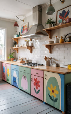 a kitchen with colorful painted cabinets and shelves