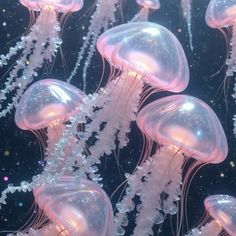 many jellyfish are floating in the water together, some have white bubbles on them
