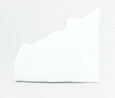 a piece of white paper that has been torn in half