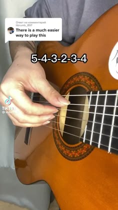 someone is playing the ukulele on their cell phone and texting it to them
