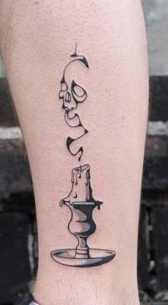 a black and white tattoo on the leg of a man with a water faucet
