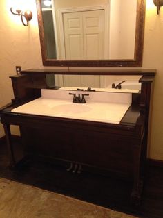 a bathroom sink with a mirror above it