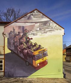 a mural on the side of a building depicts soldiers in a yellow bus carrying people