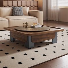 a living room with a couch, coffee table and rug