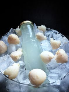 a bottle filled with ice sitting on top of a table