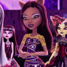 an animated image of three dolls with different hair colors and make - up, one is wearing a cat costume