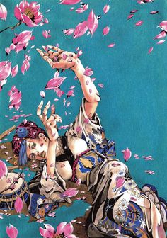 a woman laying on the ground surrounded by pink flowers with her hands in the air