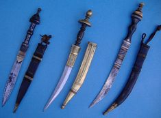 five different types of knives on a blue background