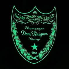 a neon sign that reads champagne dom peignon village on it's side