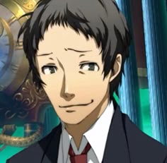 a man in a suit and tie standing next to a clock