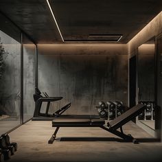 an empty gym with equipment in the foreground