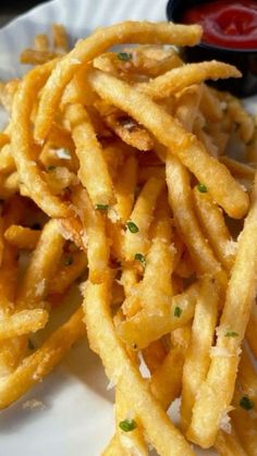 french fries on a plate with ketchup and mustard