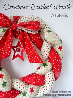 a christmas wreath made with red and white fabric, stars and polka dot ribbon on the front