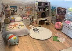 a room with toys and books on the floor