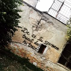 graffiti on the side of an old building