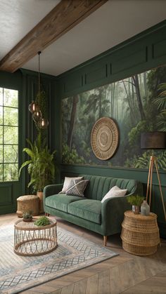 a living room with green walls and wood flooring, large painting on the wall