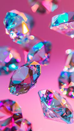 many different colored diamonds are flying in the air on a pink and blue background,