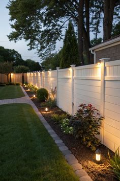 a white fence with some lights on it