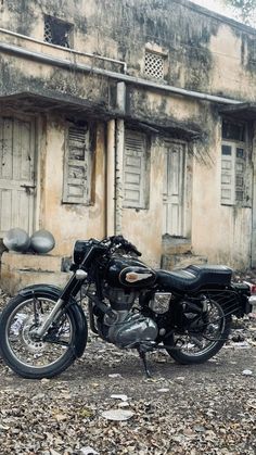 a motorcycle parked in front of an old building