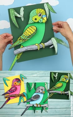 someone is holding up some paper cut outs with birds on them