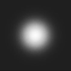 a black and white image of a bright light in the night sky with no clouds