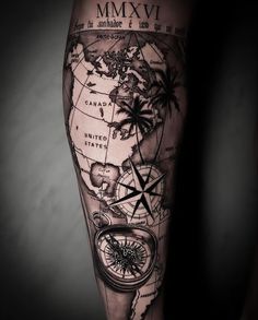 a man's arm with a map and compass tattoo on the left side of his leg