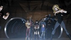 a group of people standing next to each other in front of a giant wheel with the word x - men on it