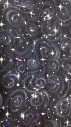 a black background with white stars and swirls