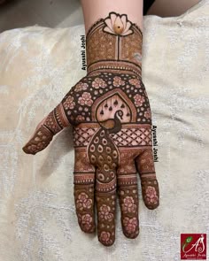 henna tattoo on the palm of a woman's hand